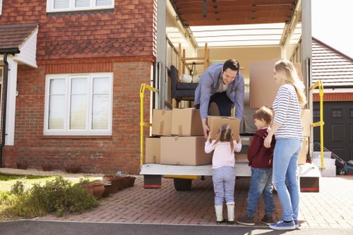 Moving boxes and household items with a van in Wimbledon