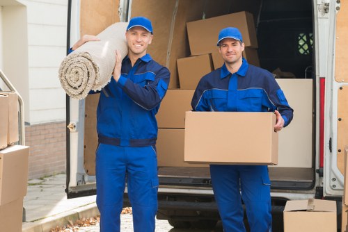 Professional removal team loading boxes for a Wimbledon house move