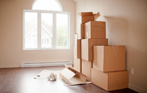 Office relocation with movers carrying furniture in Wimbledon