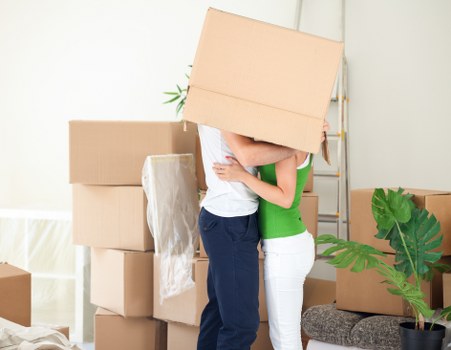 Removal professionals discussing a move plan and risk assessment