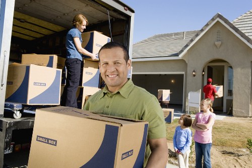 Professional movers loading furniture with care