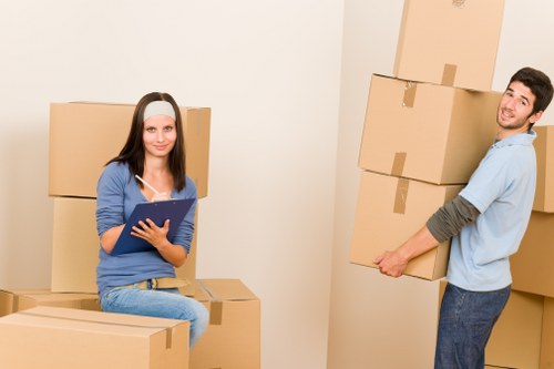 Professional packers preparing fragile belongings for a Wimbledon move
